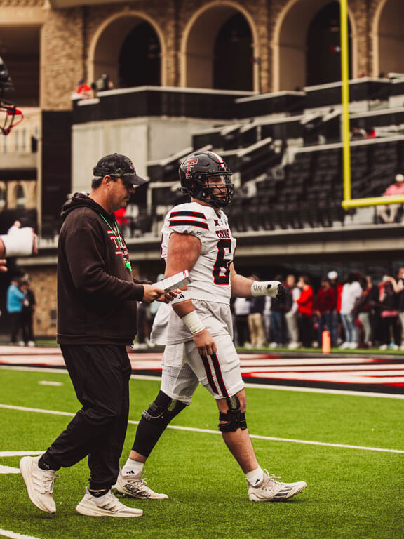 Jurrien and Clay McGuire, TTU Football Offensive Line Coach