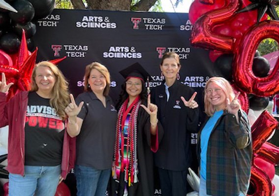 Texas Tech University College of Arts and Sciences Office of Student Success Staff poses with graduate