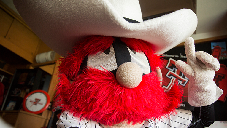 texas tech raider red mascot hold guns up