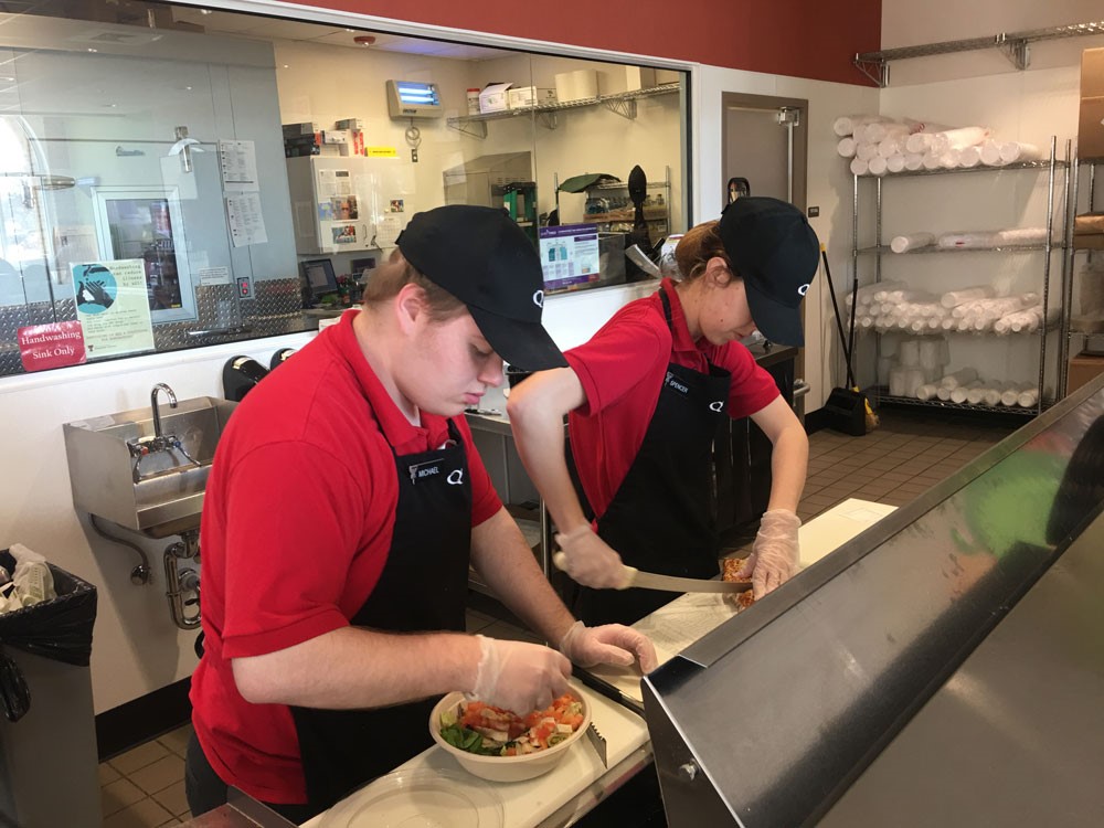 Transition Academy students working at Quiznos