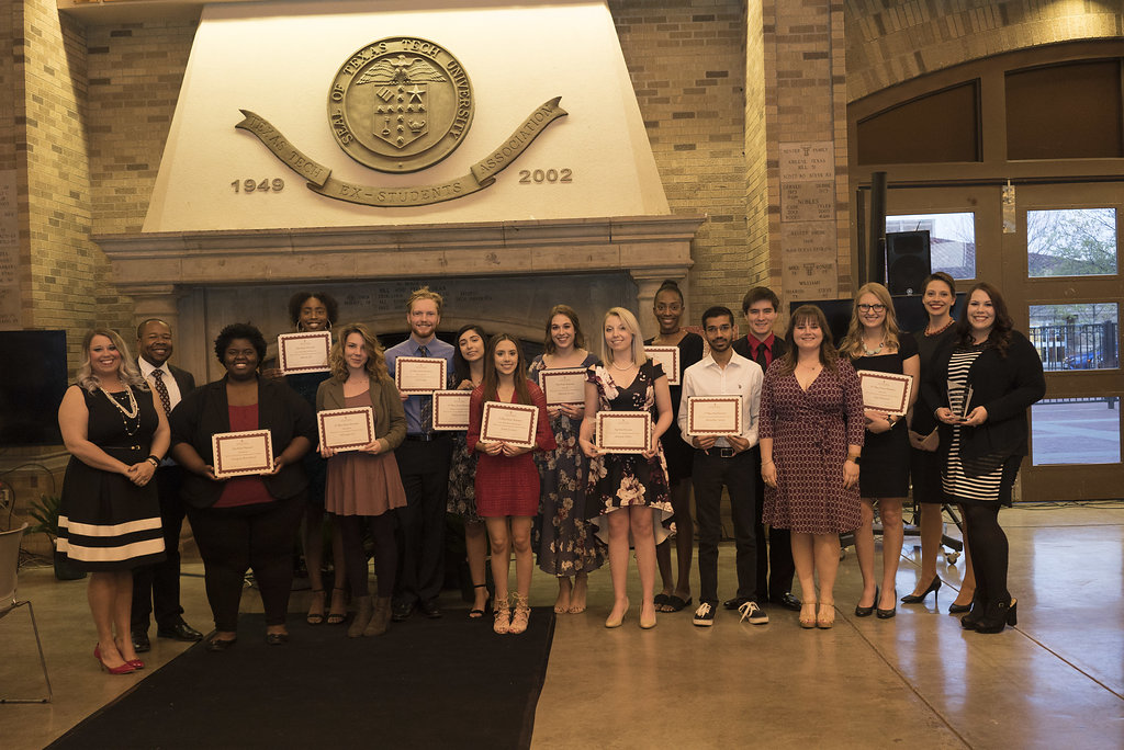 Conference award winners pose as group at banquet