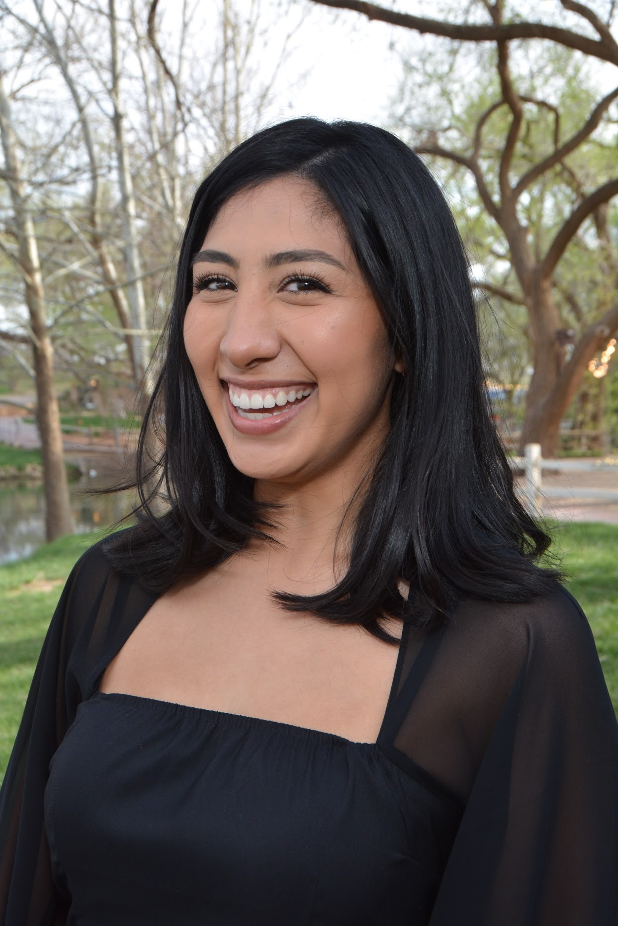Woman smiling in black top