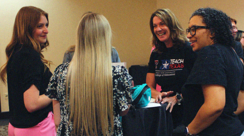 Students networking at fair