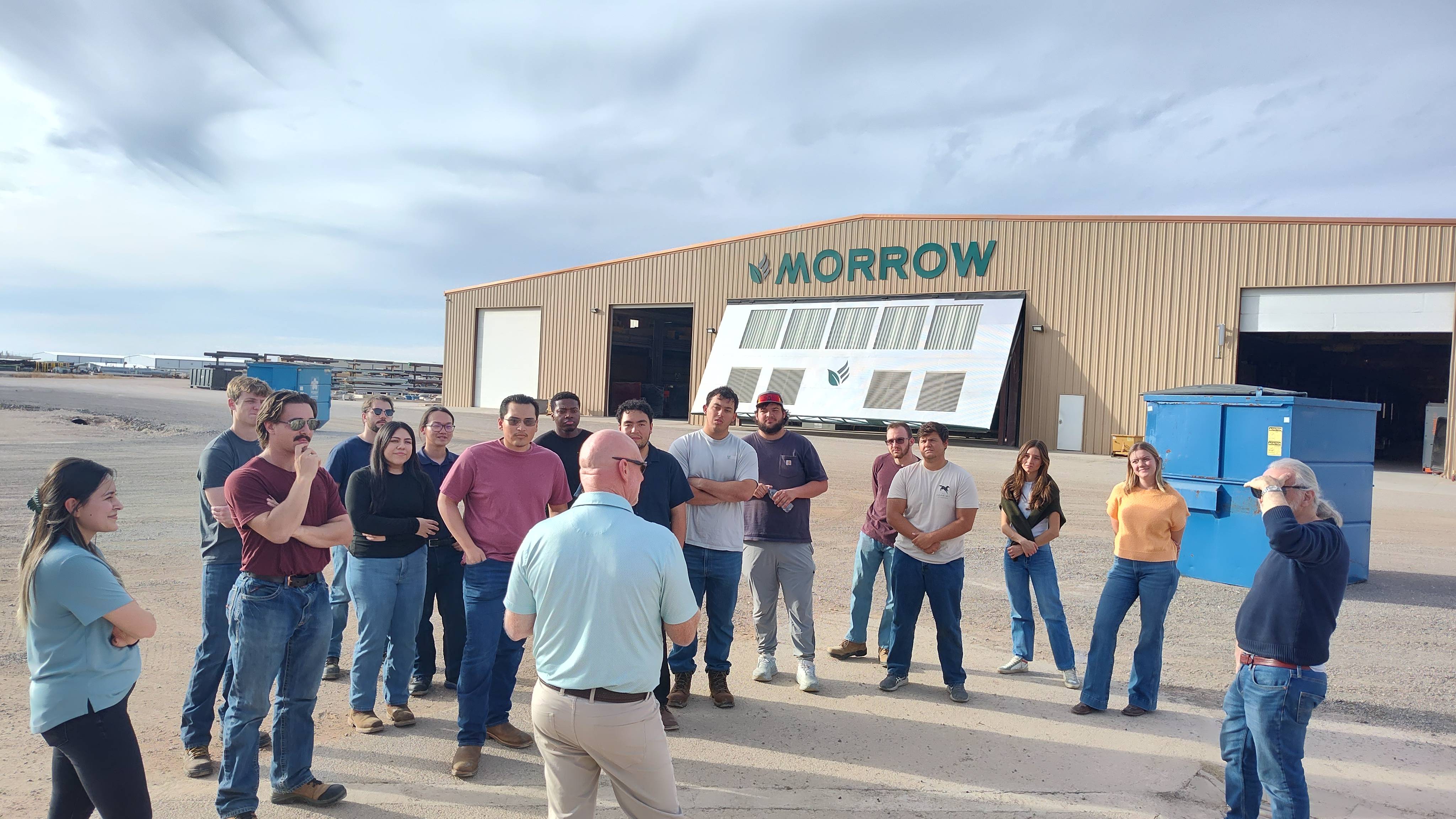 Students working together to replace a pump component.