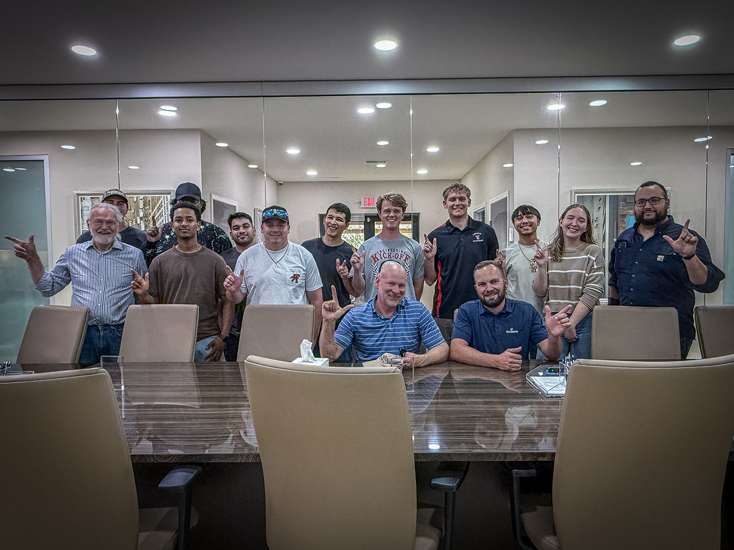 Students working together to replace a pump component.