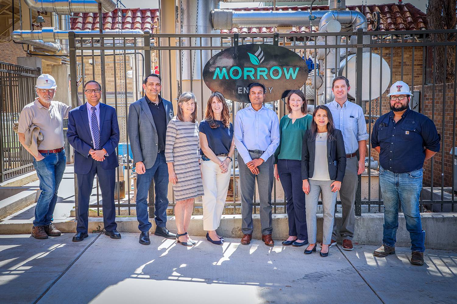 Students working together to replace a pump component.