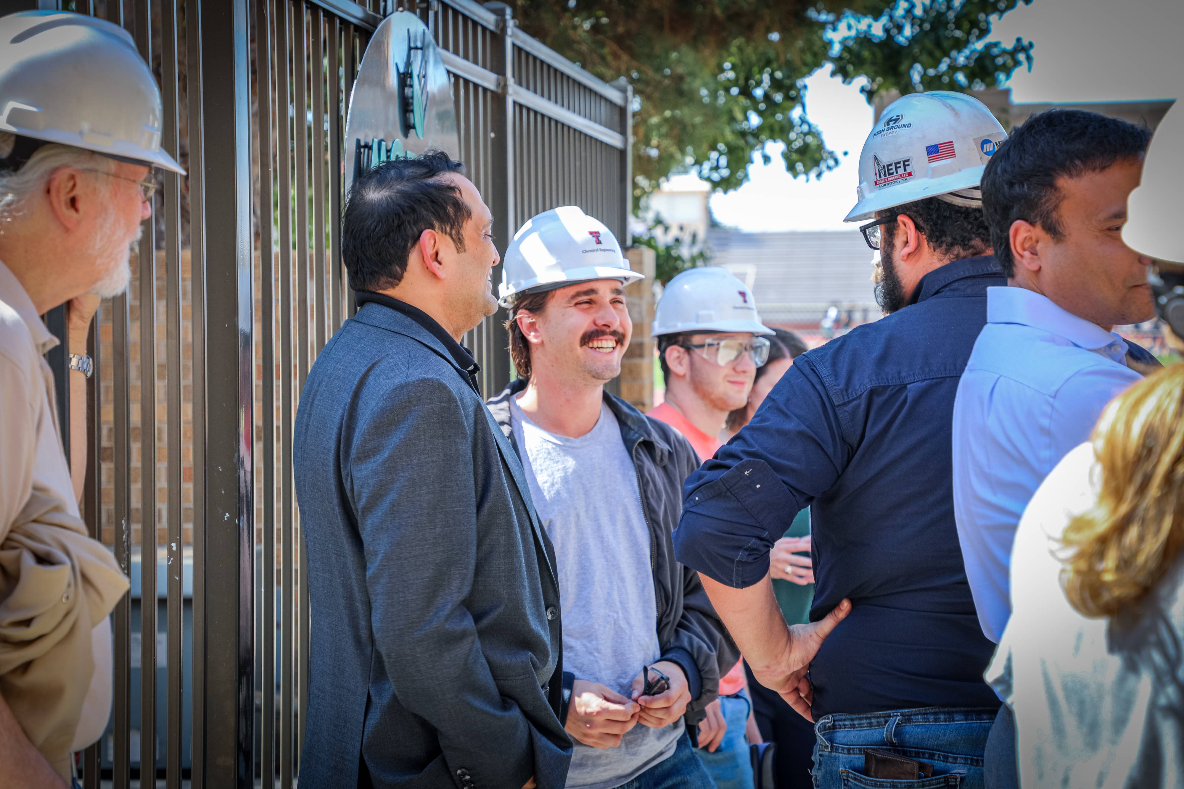 Students working together to replace a pump component.