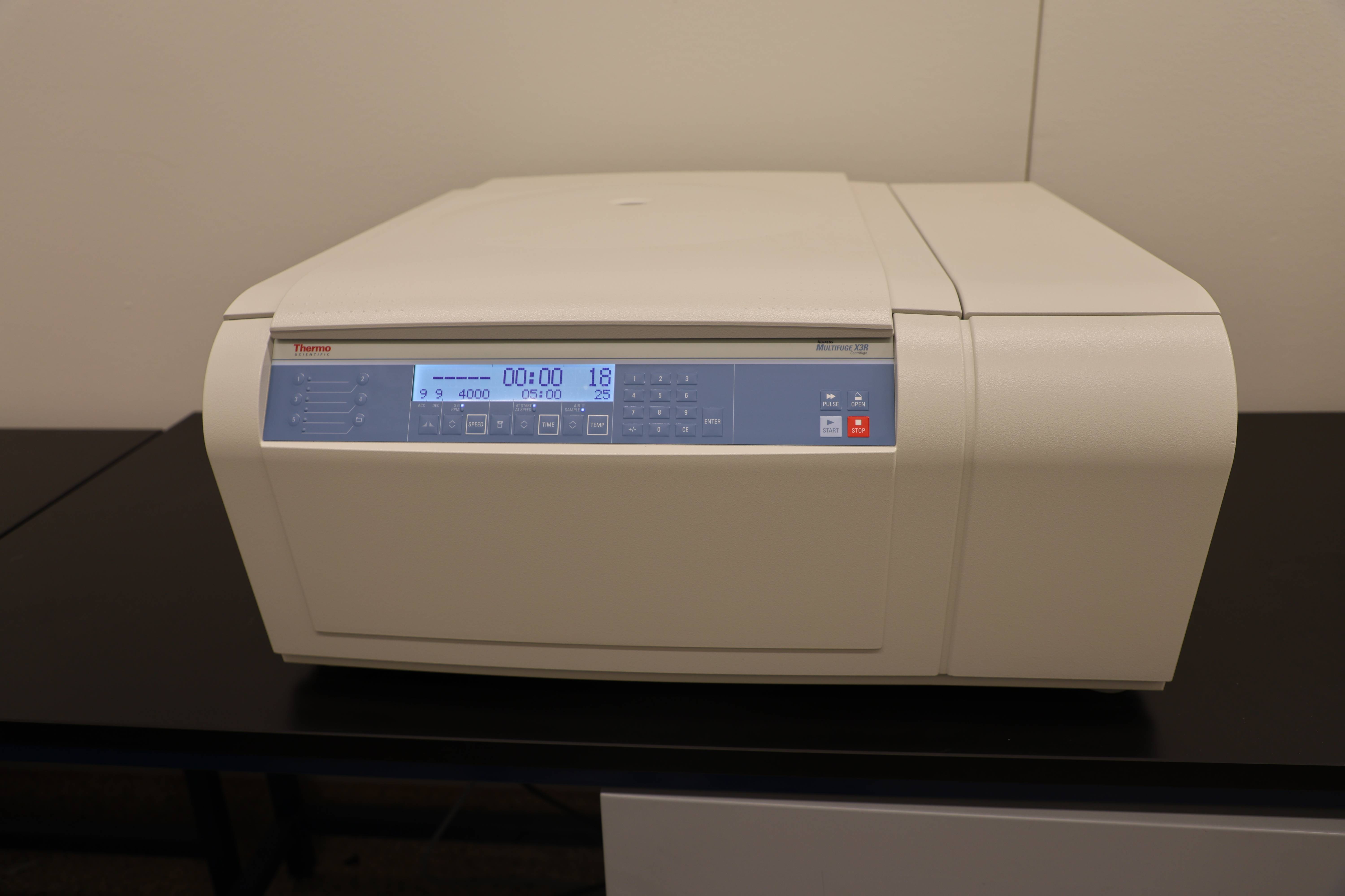 Students working together to replace a pump component.