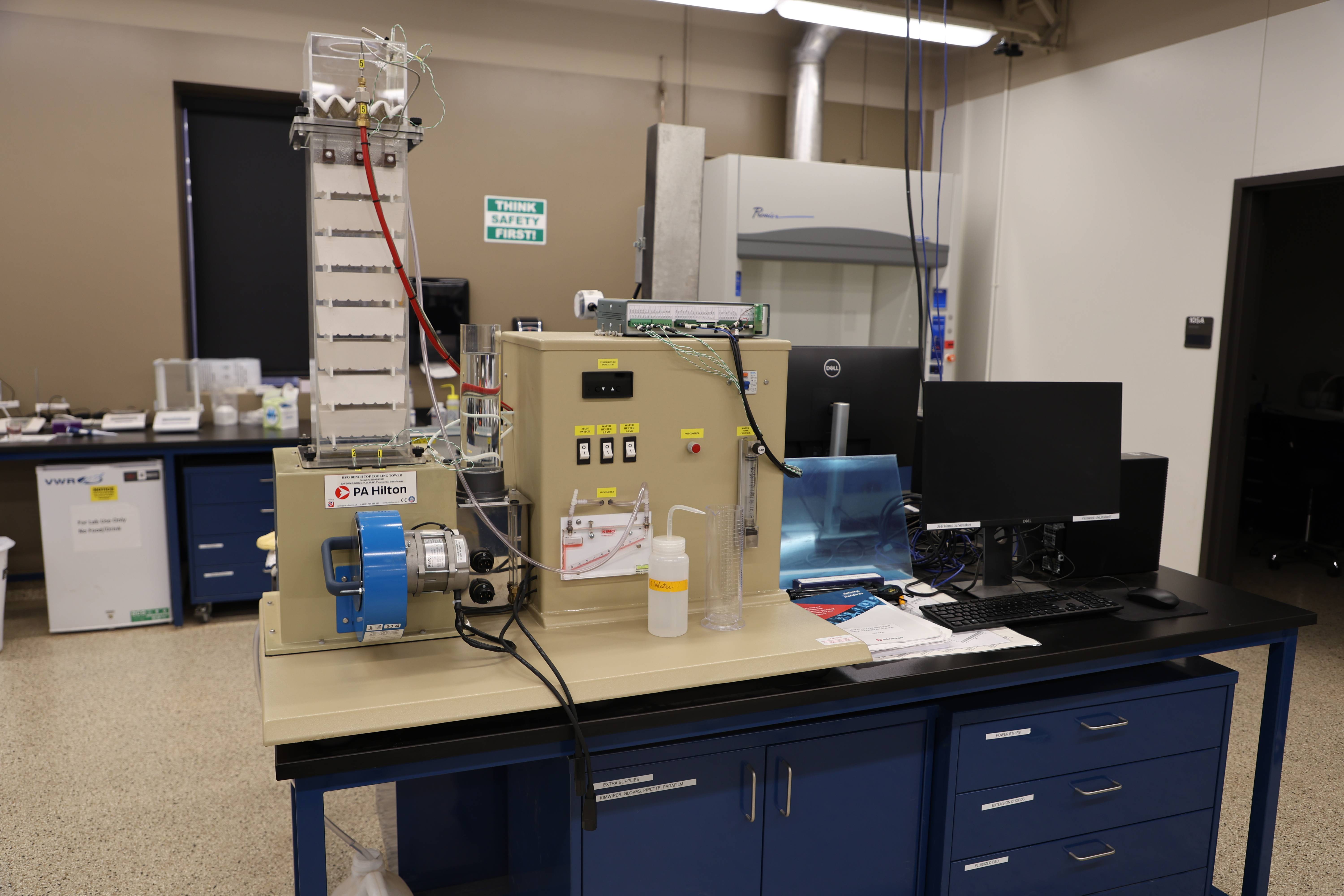 Students working together to replace a pump component.