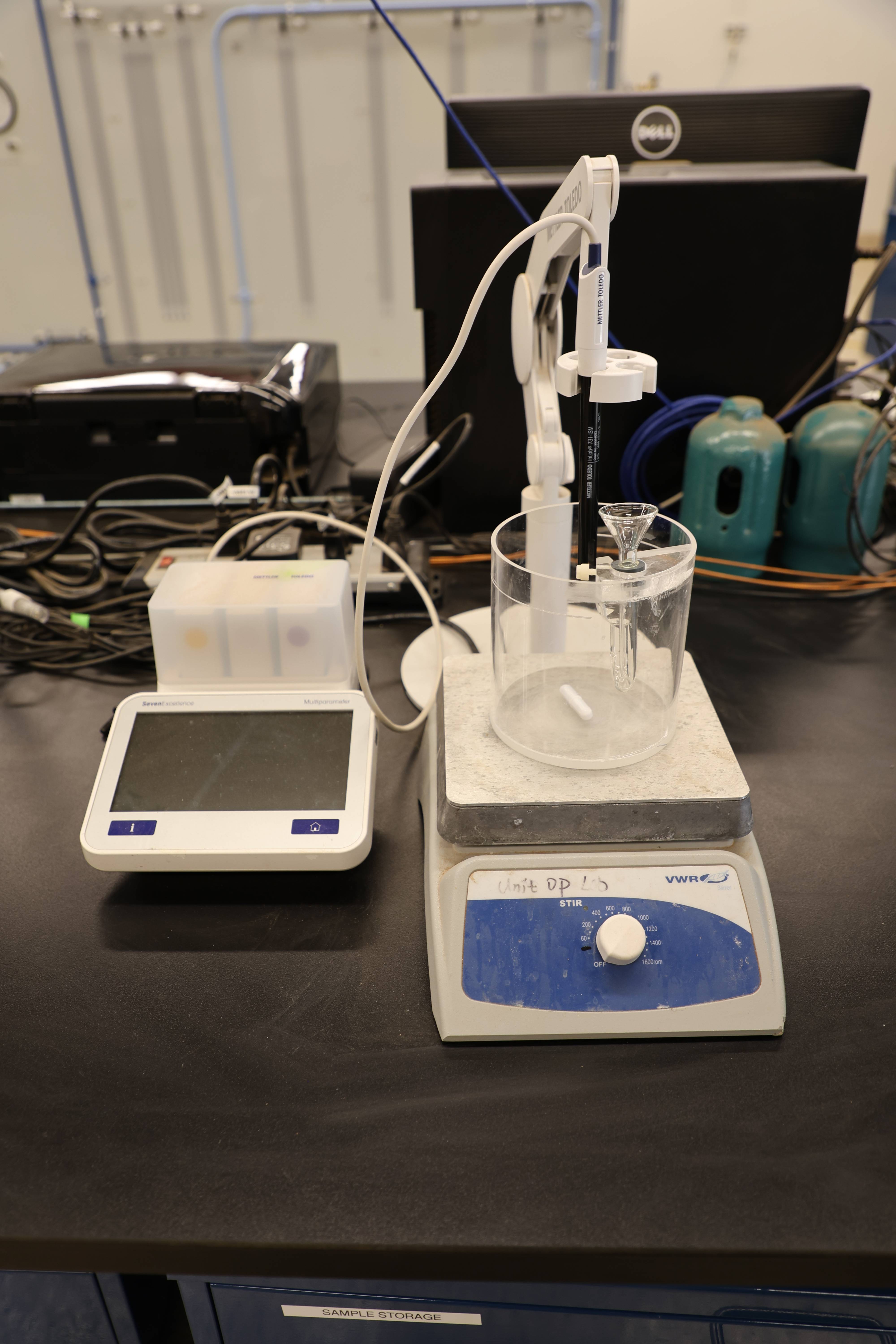 Students working together to replace a pump component.