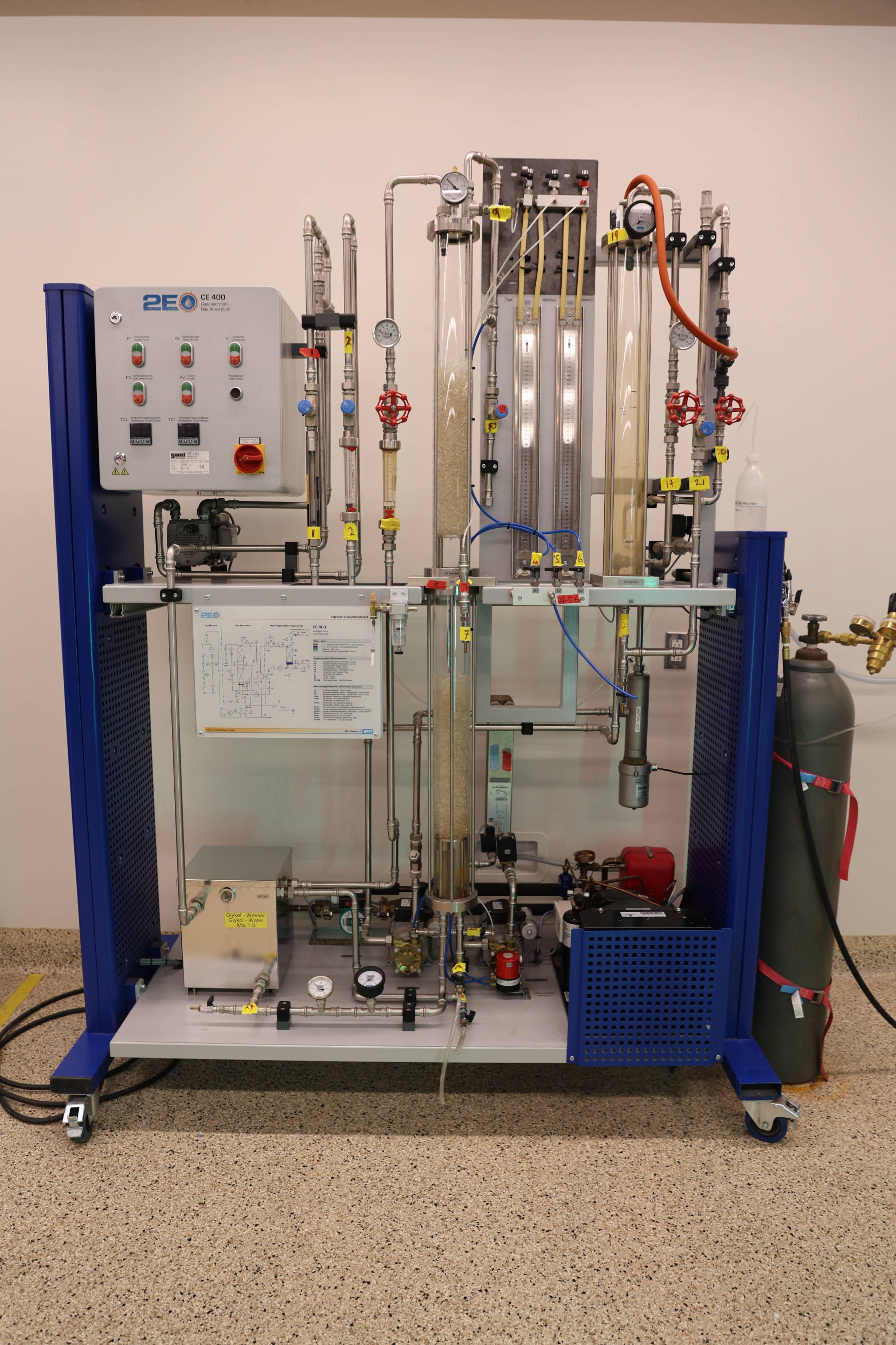 Students working together to replace a pump component.