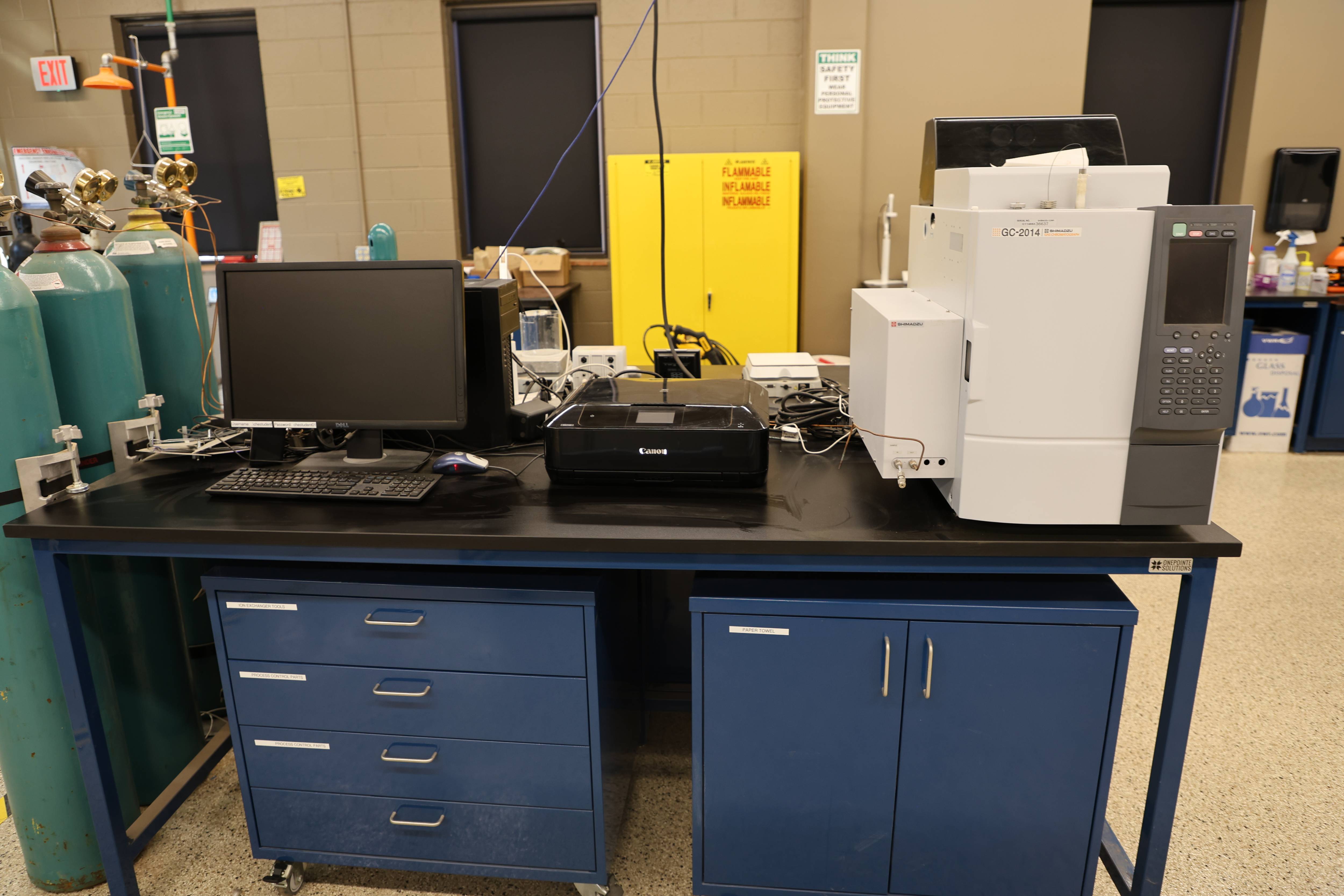 Students working together to replace a pump component.