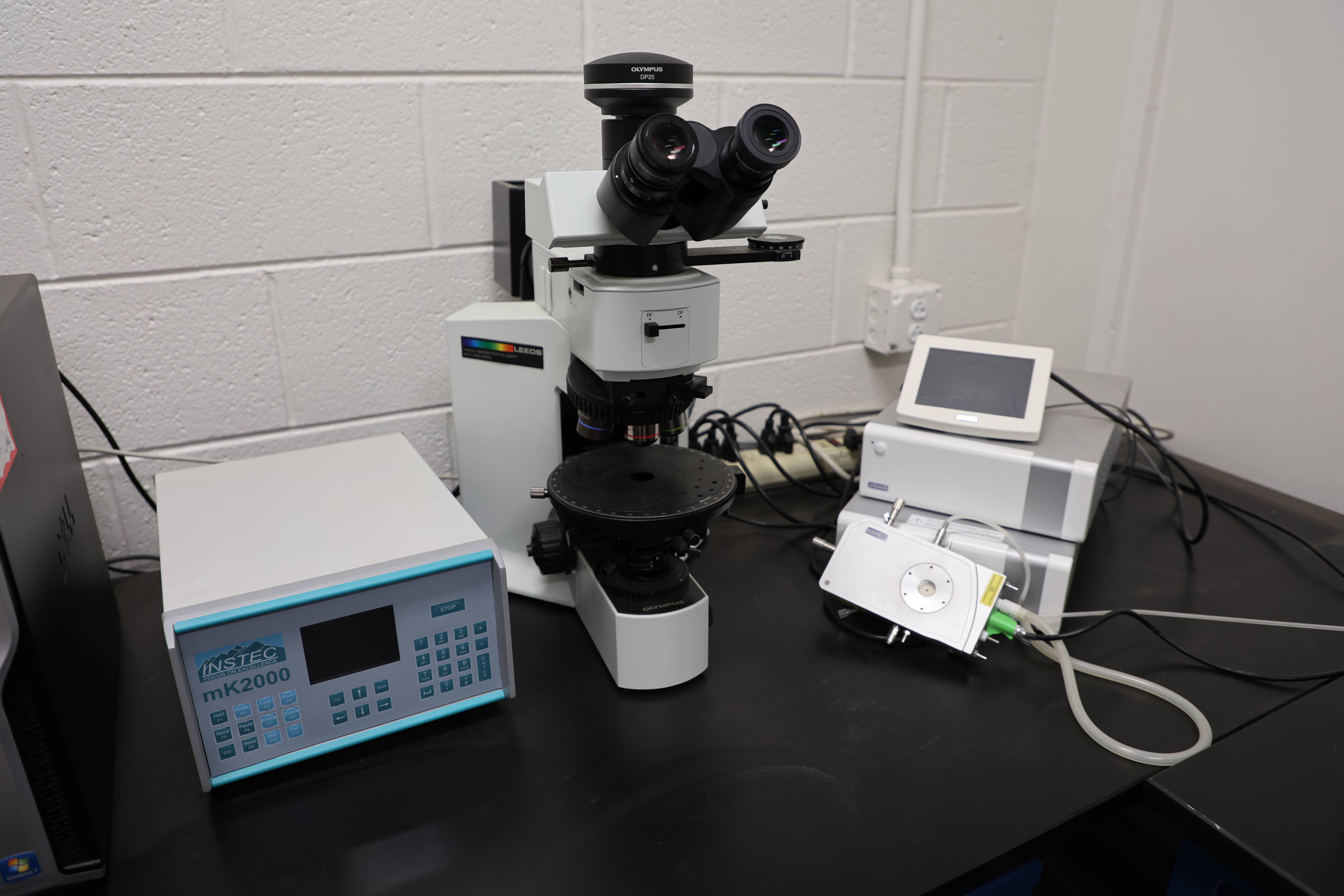 Students working together to replace a pump component.