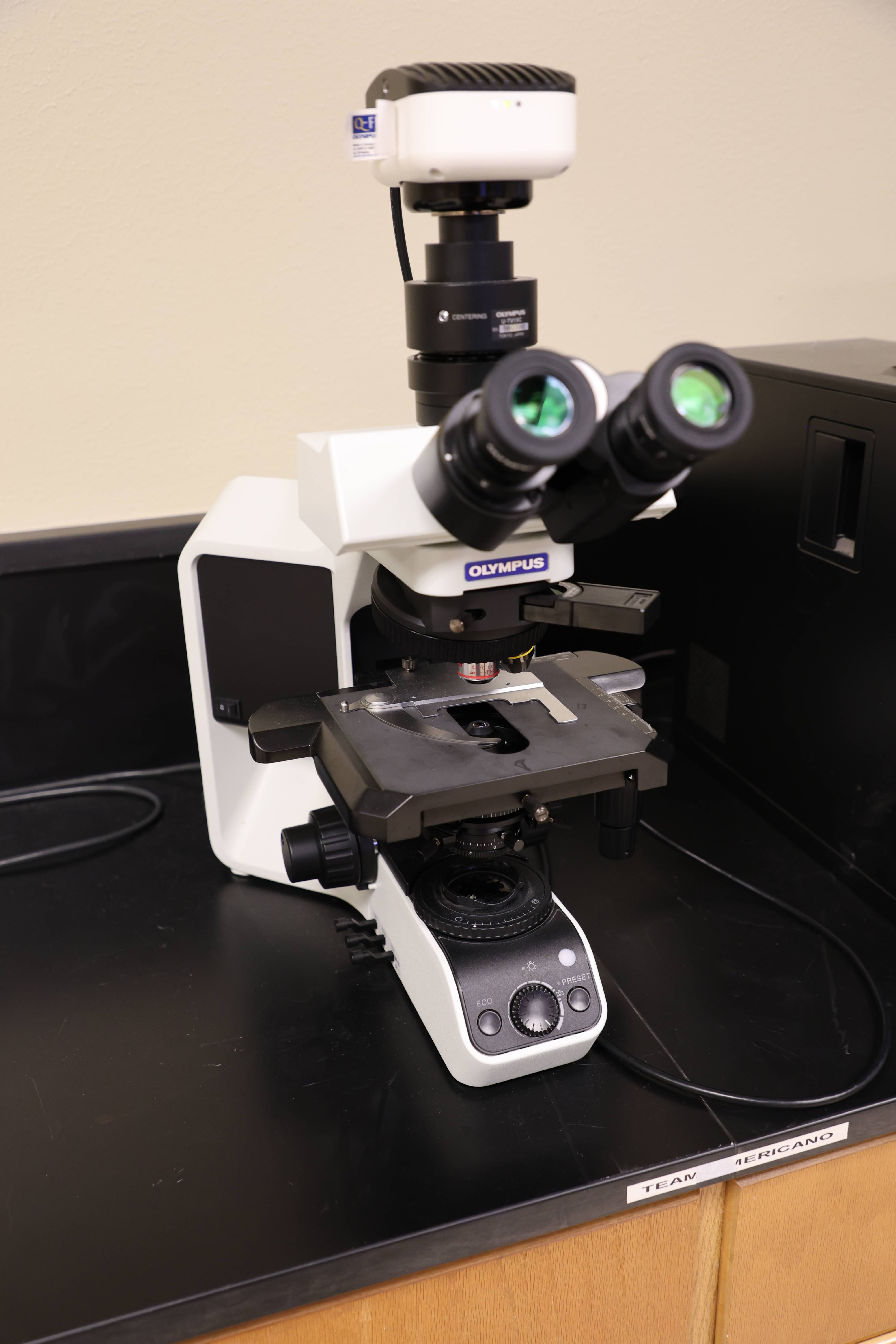 Students working together to replace a pump component.