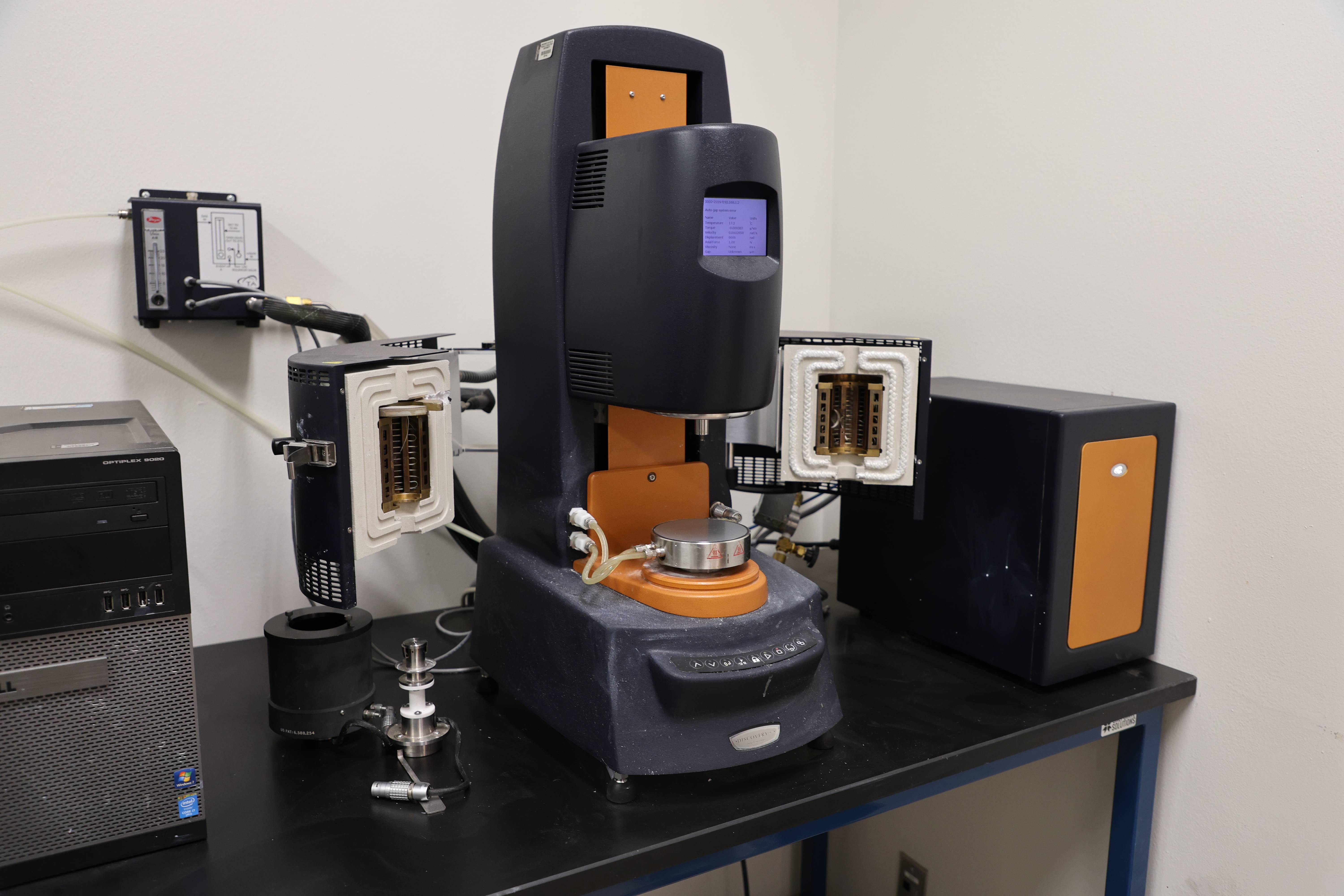 Students working together to replace a pump component.