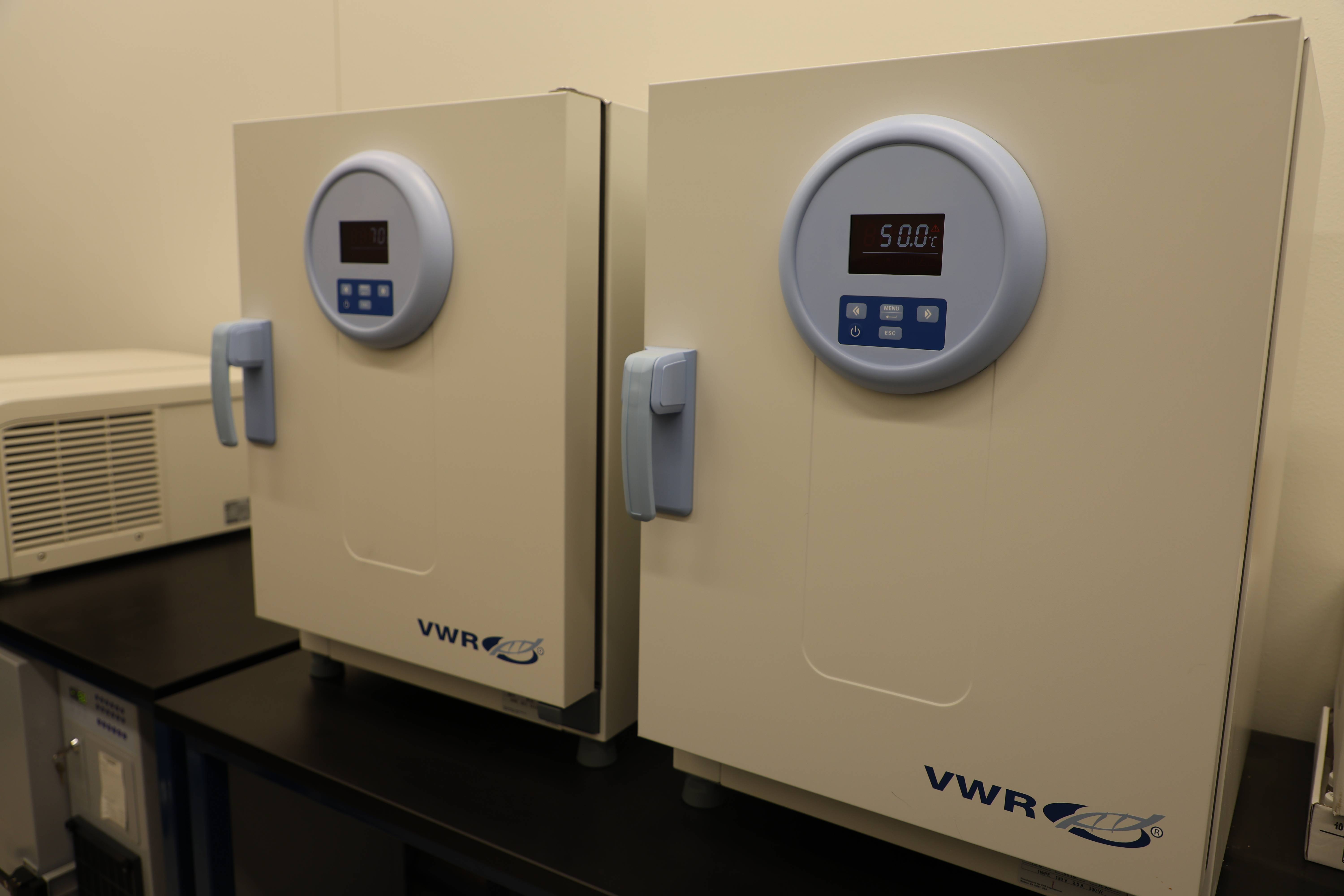 Students working together to replace a pump component.