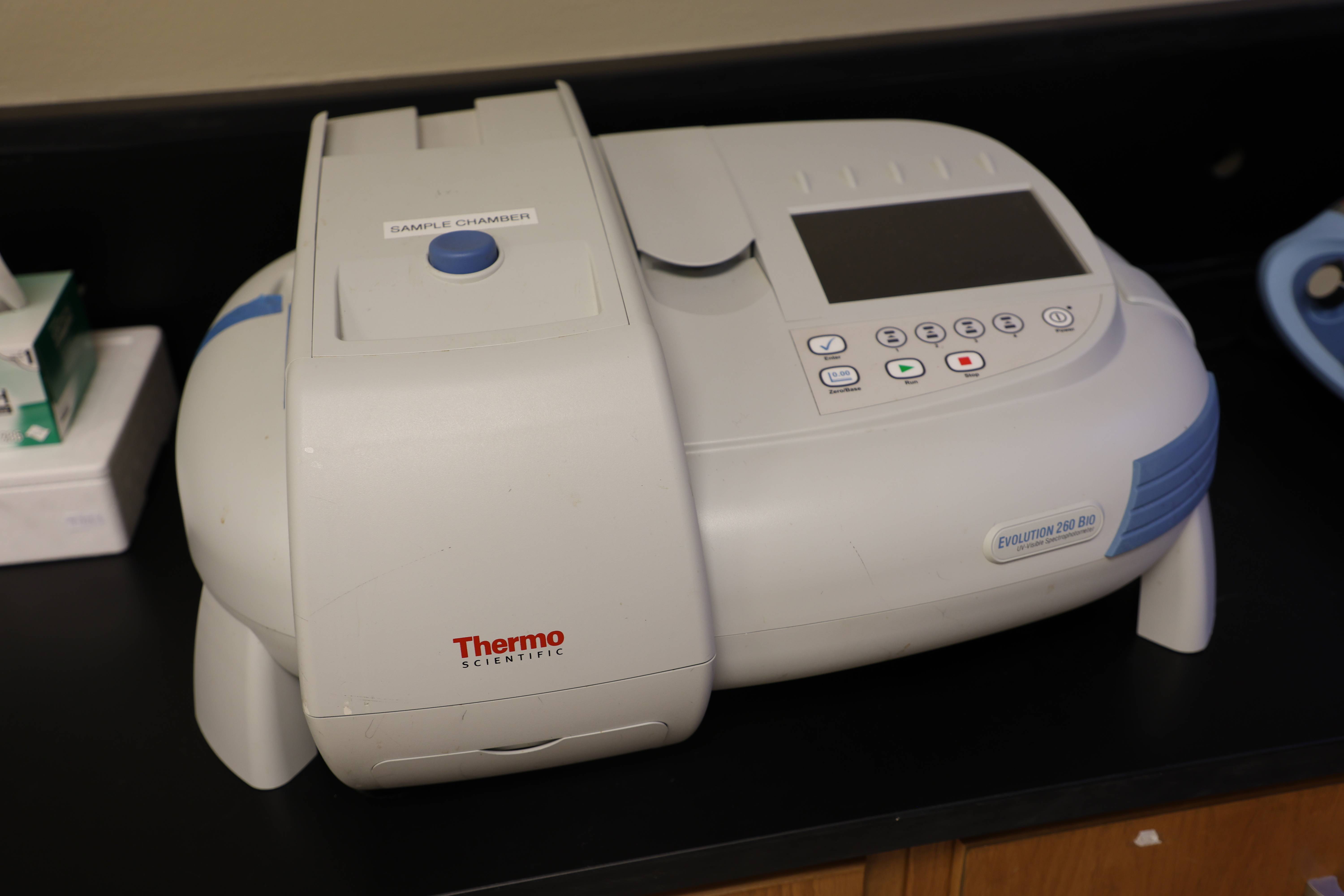 Students working together to replace a pump component.