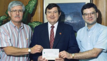 Original Program Directors Dr. John Burns (left) and Dr. Larry Blanton (right) receive the first HHMI grant check from Dr. Steven Lawless, TTU President (1989-96)