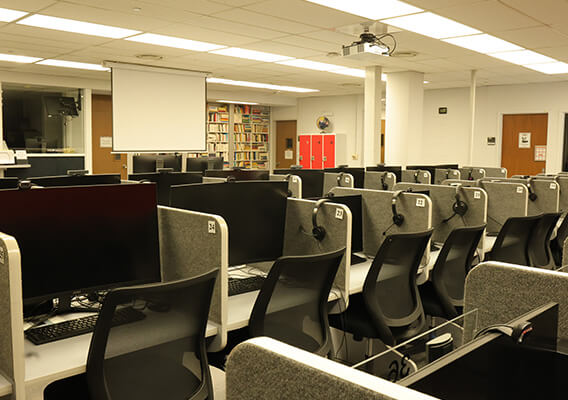 desks and computers in the language lab