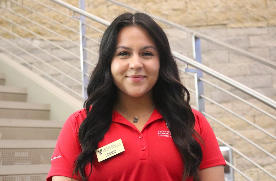 dark haired women in red polo