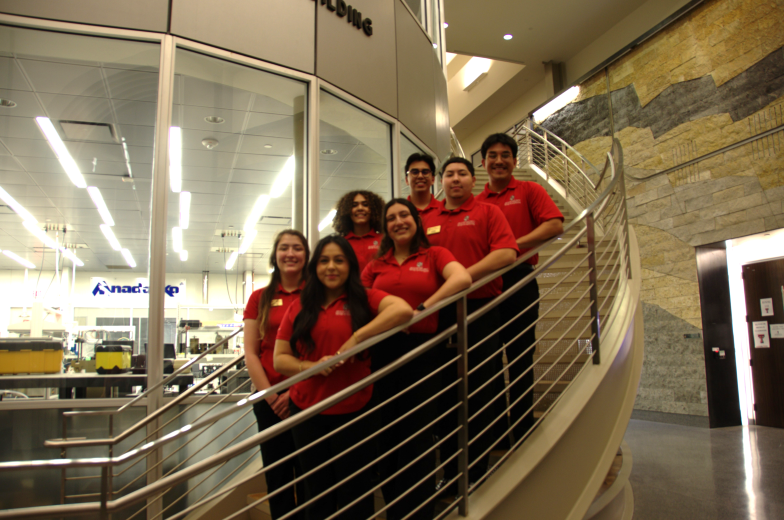 group of people in red polos