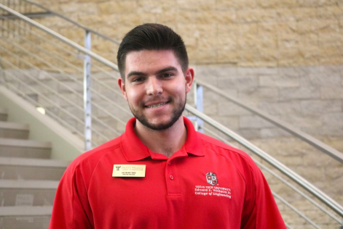 man in red polo