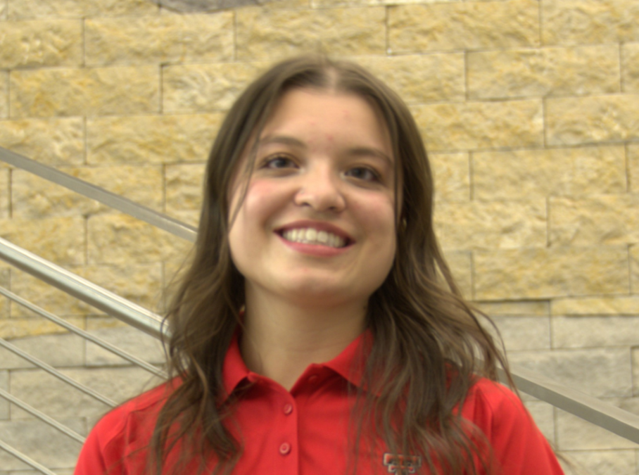 woman in red polo