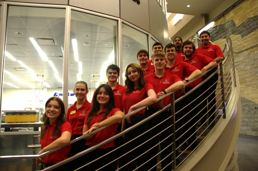 group of people in red polos
