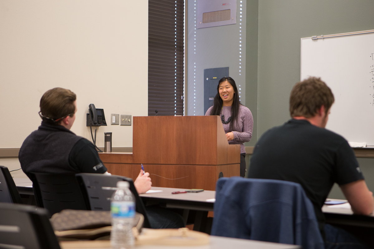 Student giving a speech at a podium