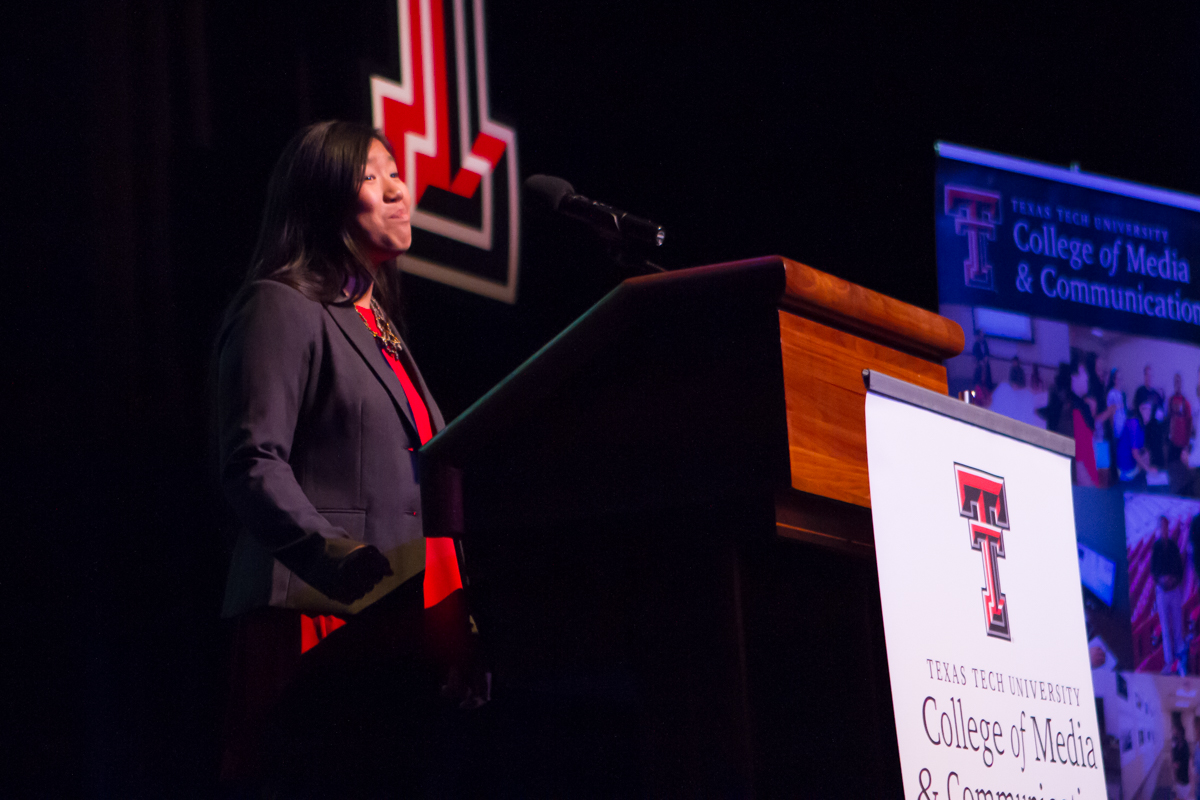 Finalist giving their speech on stage in front of 800 people