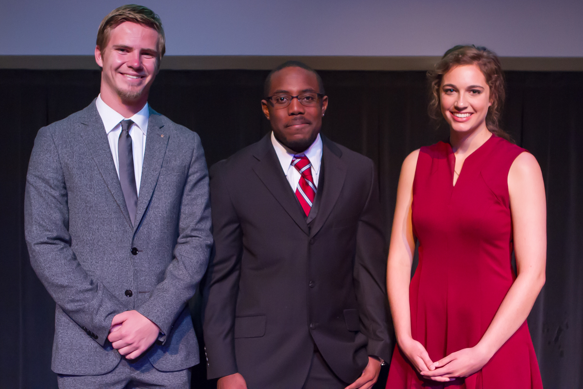 Top three finalist standing together smiling