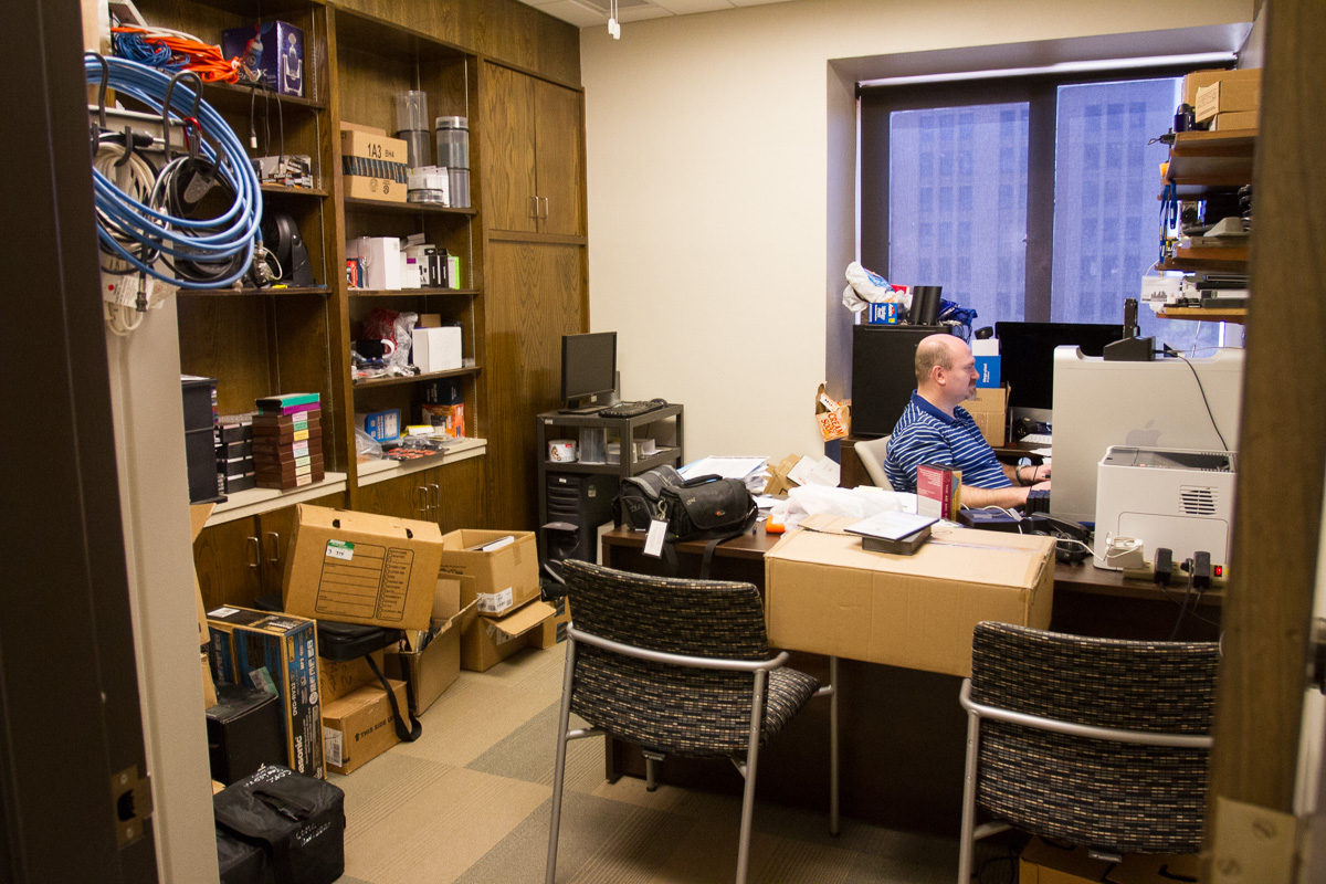 Josh Robinson sitting at his desk