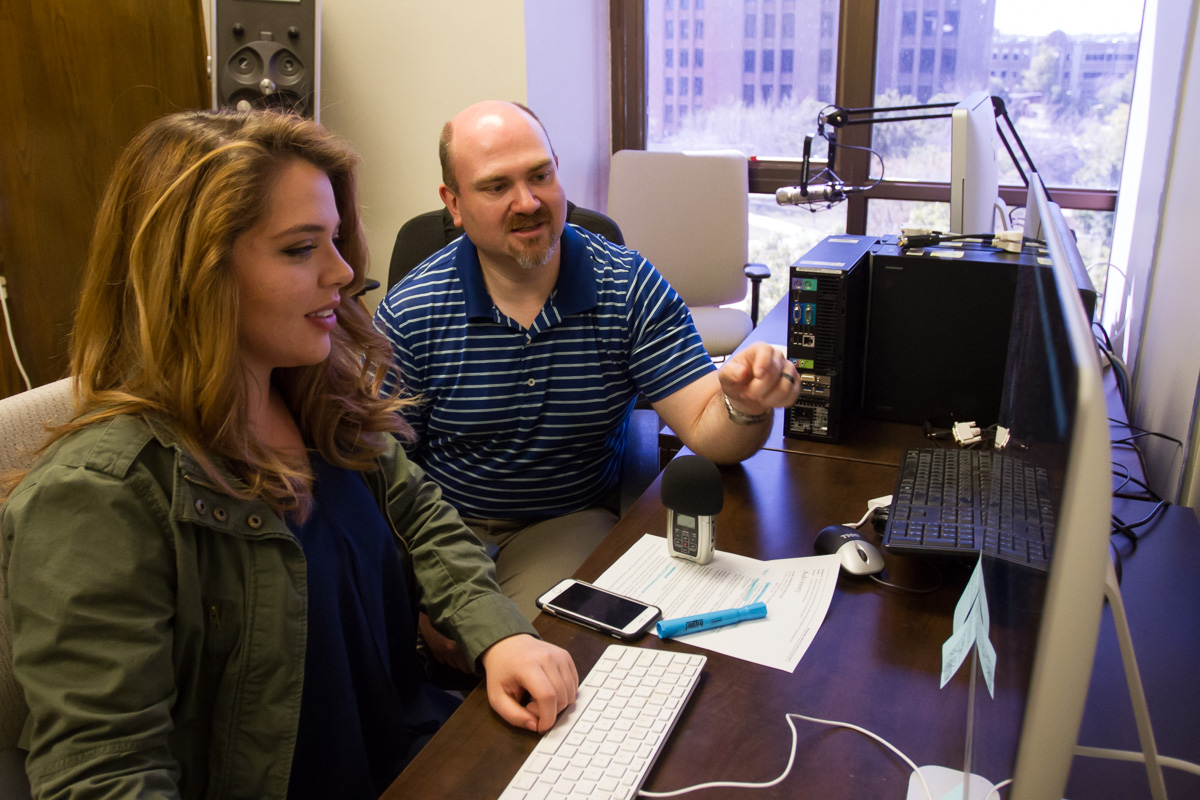 Josh and Laura Duclos sitting at a computer