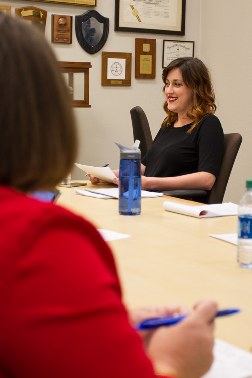 Cameron laughing in a meeting