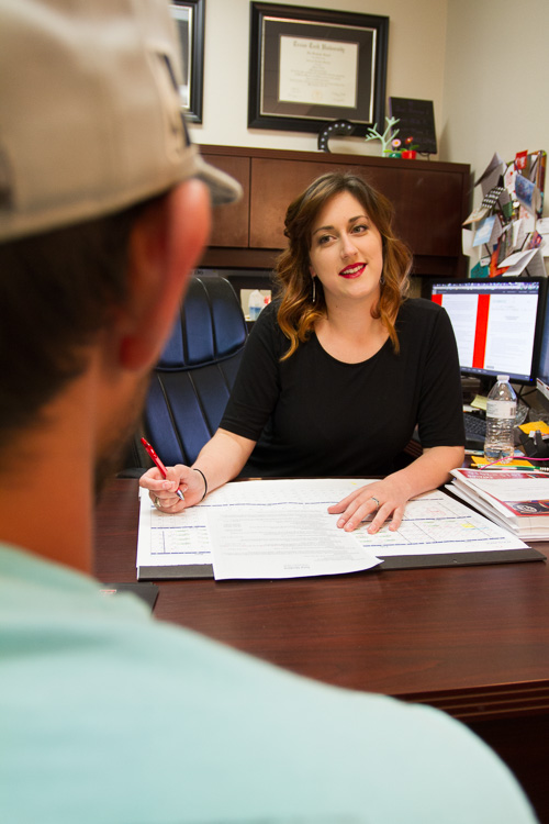 Cameron talking to a student