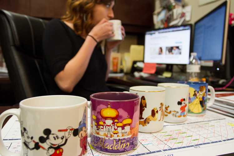 Cameron's coffee mug collection on her desk