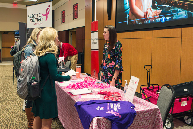 Two students speaking with a recruiter