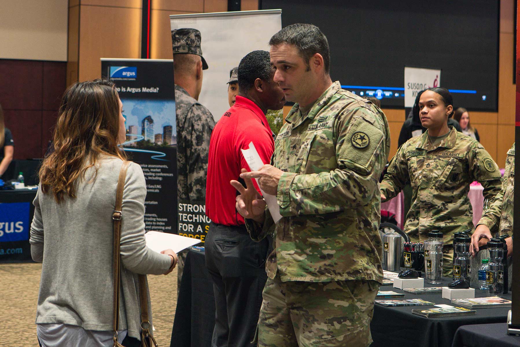 Soldier talking to a student