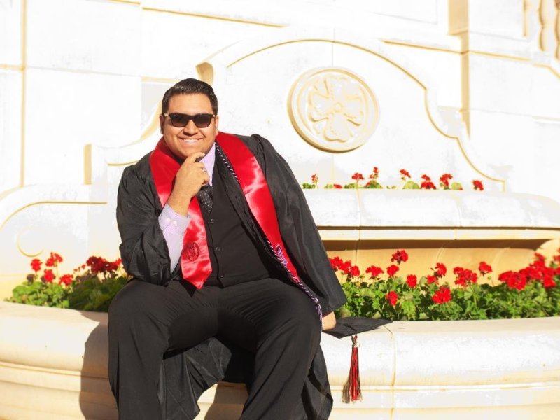 Jake Quintanilla in front of the TTU seal