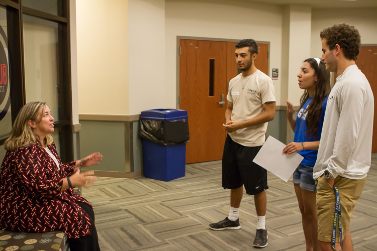 Dr. Gilmore coaches a group of students Dr. Gilmore coaches a group of students