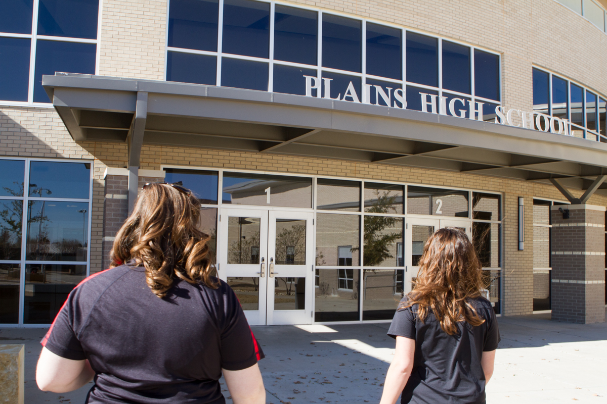 Emily and Candace in front of Plains High School