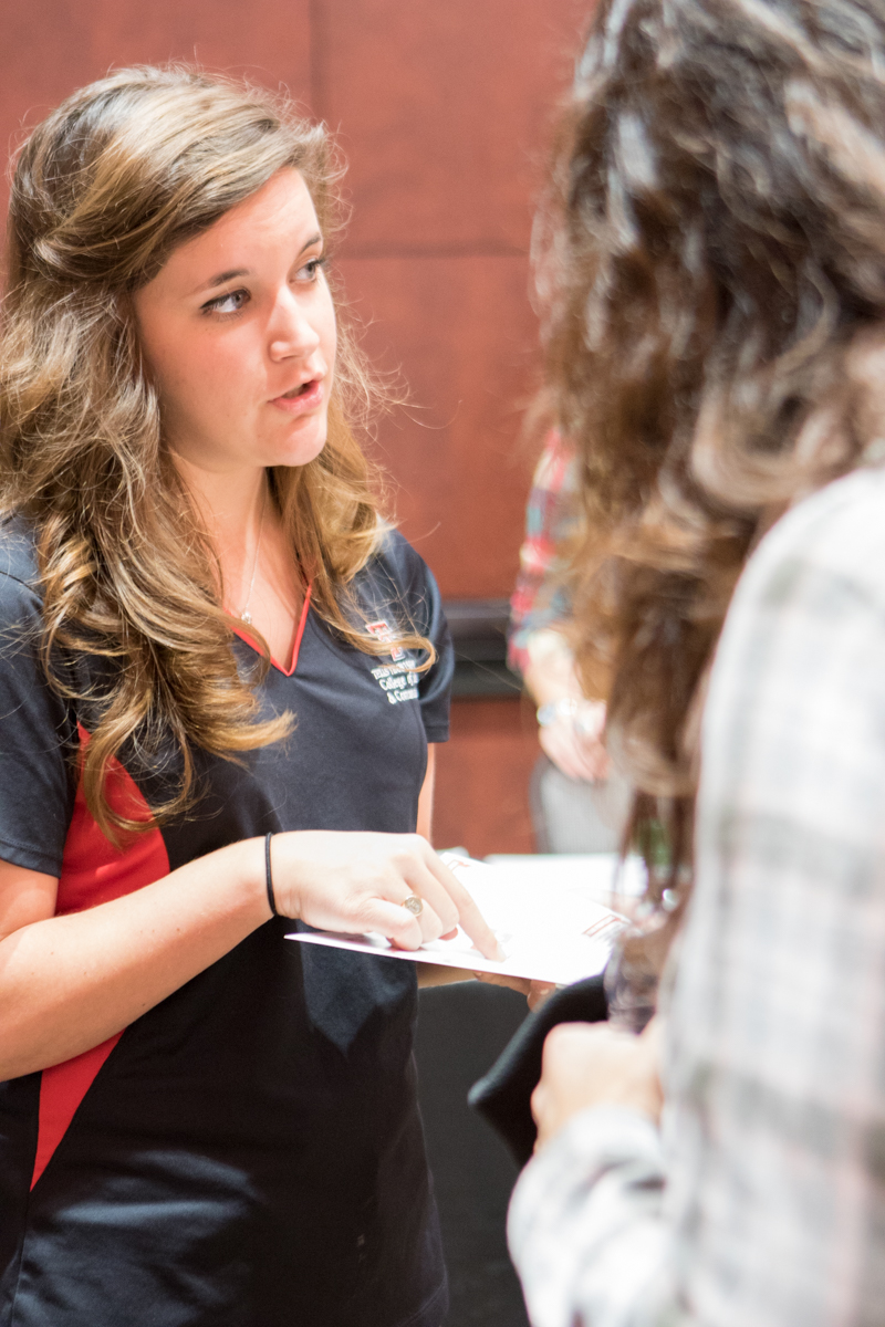 Candace talking to a high school student about our college