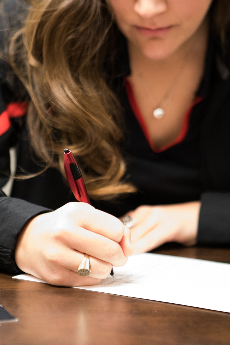 Candace writing down her next appointment