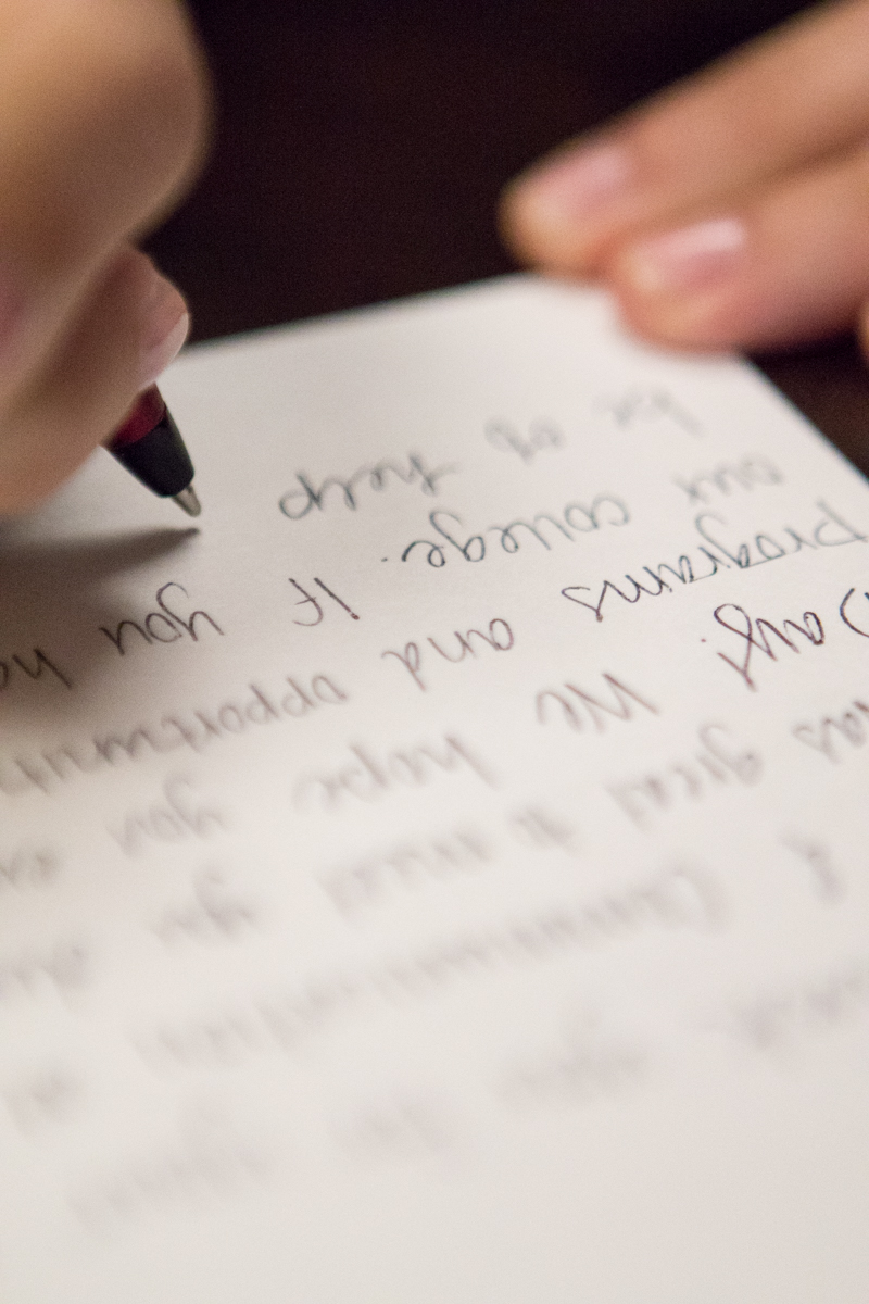 Candace writing thank you letters to send to teachers