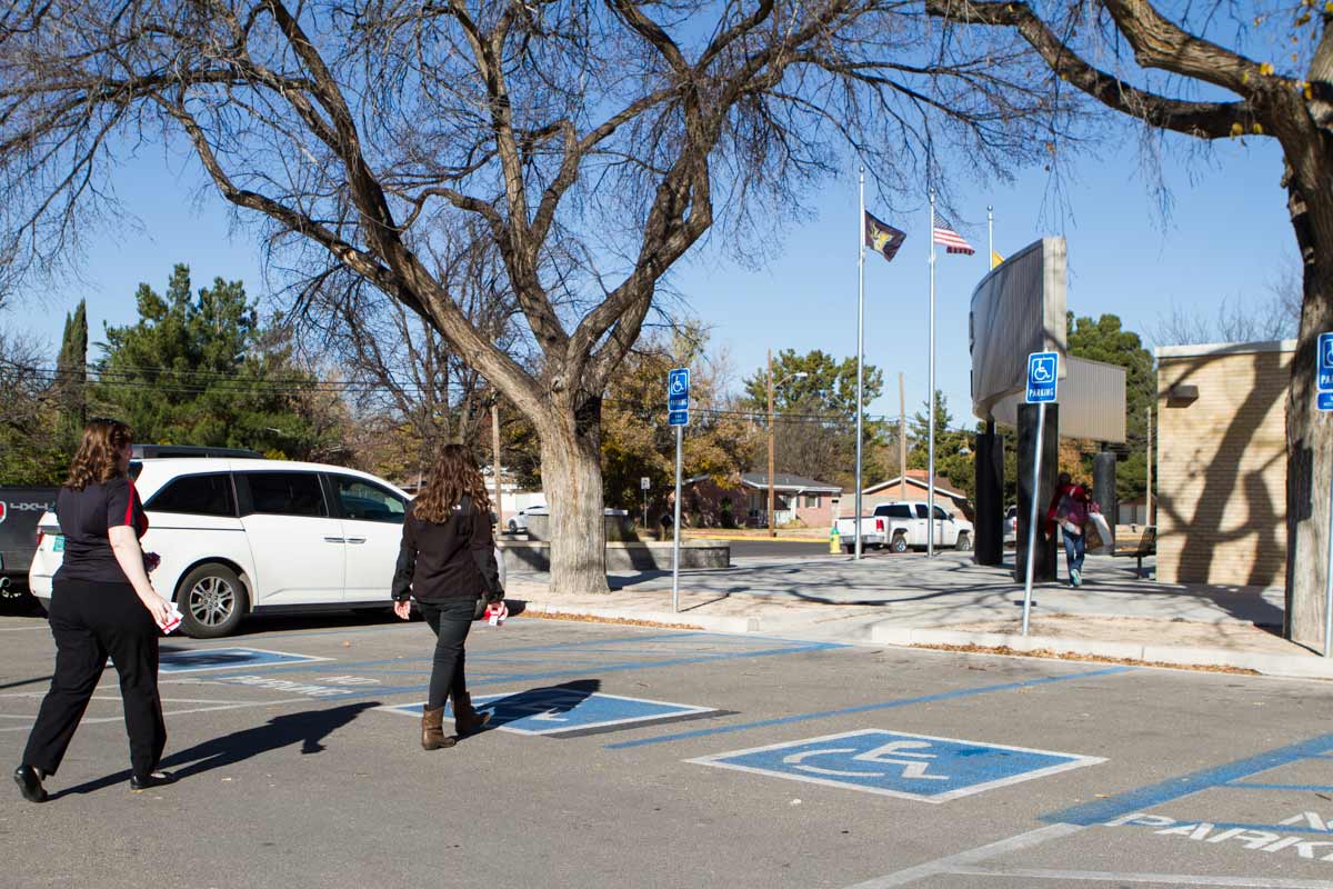 Emily and Candace walking into a school