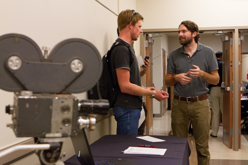 Student talking to professor