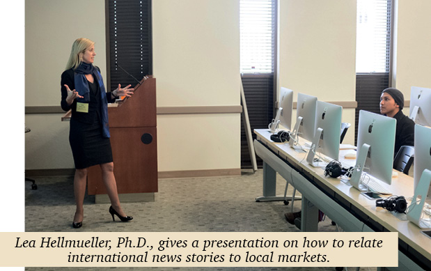 Lea Hellmueller standing, giving a presentation to a class