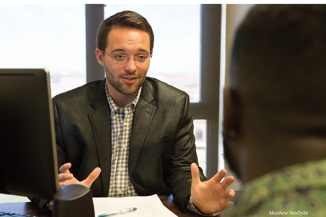 Matthew VanDyke talking at a desk