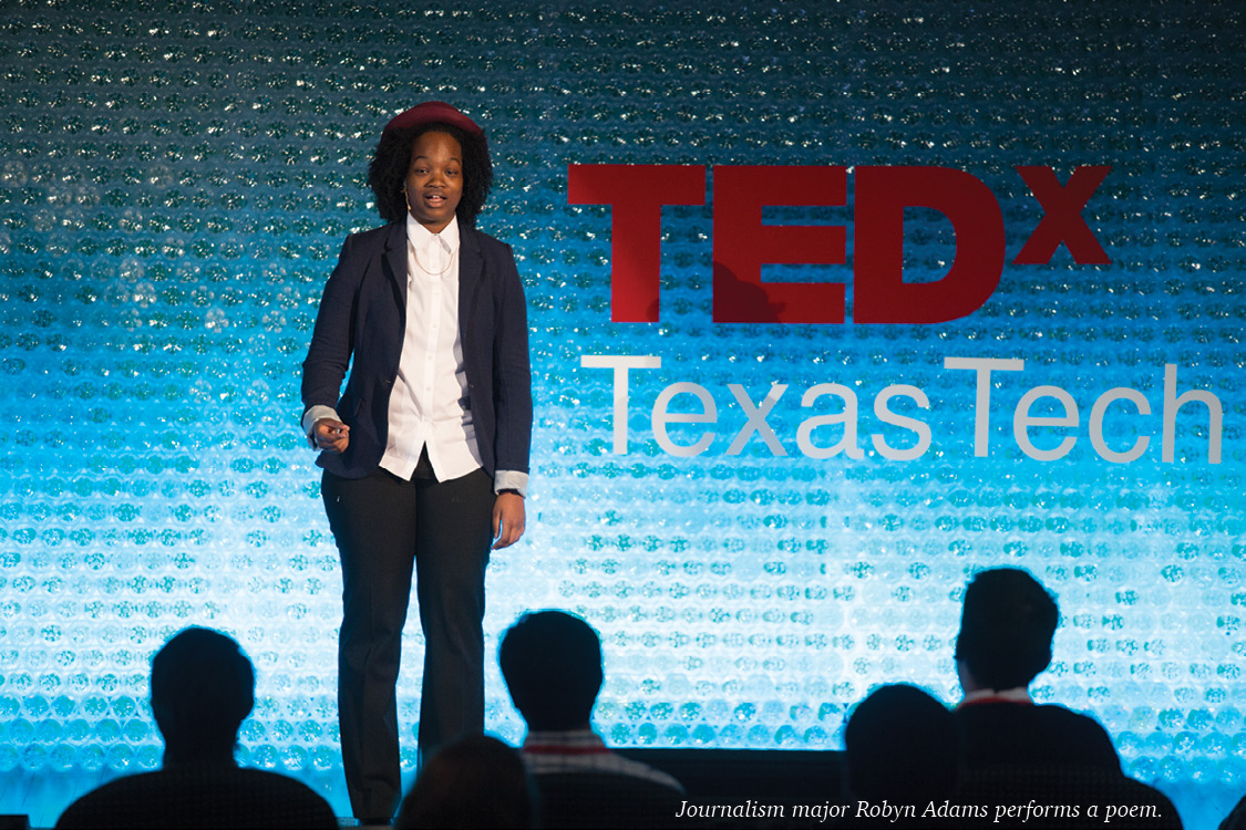 Robyn Adams performing on stage at TEDx