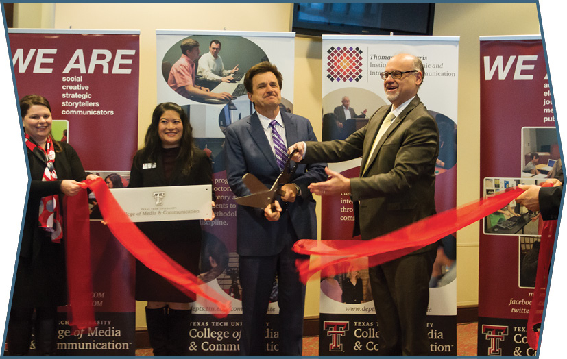 Dean David Perlmutter cutting the ribbon welcoming the COMS department